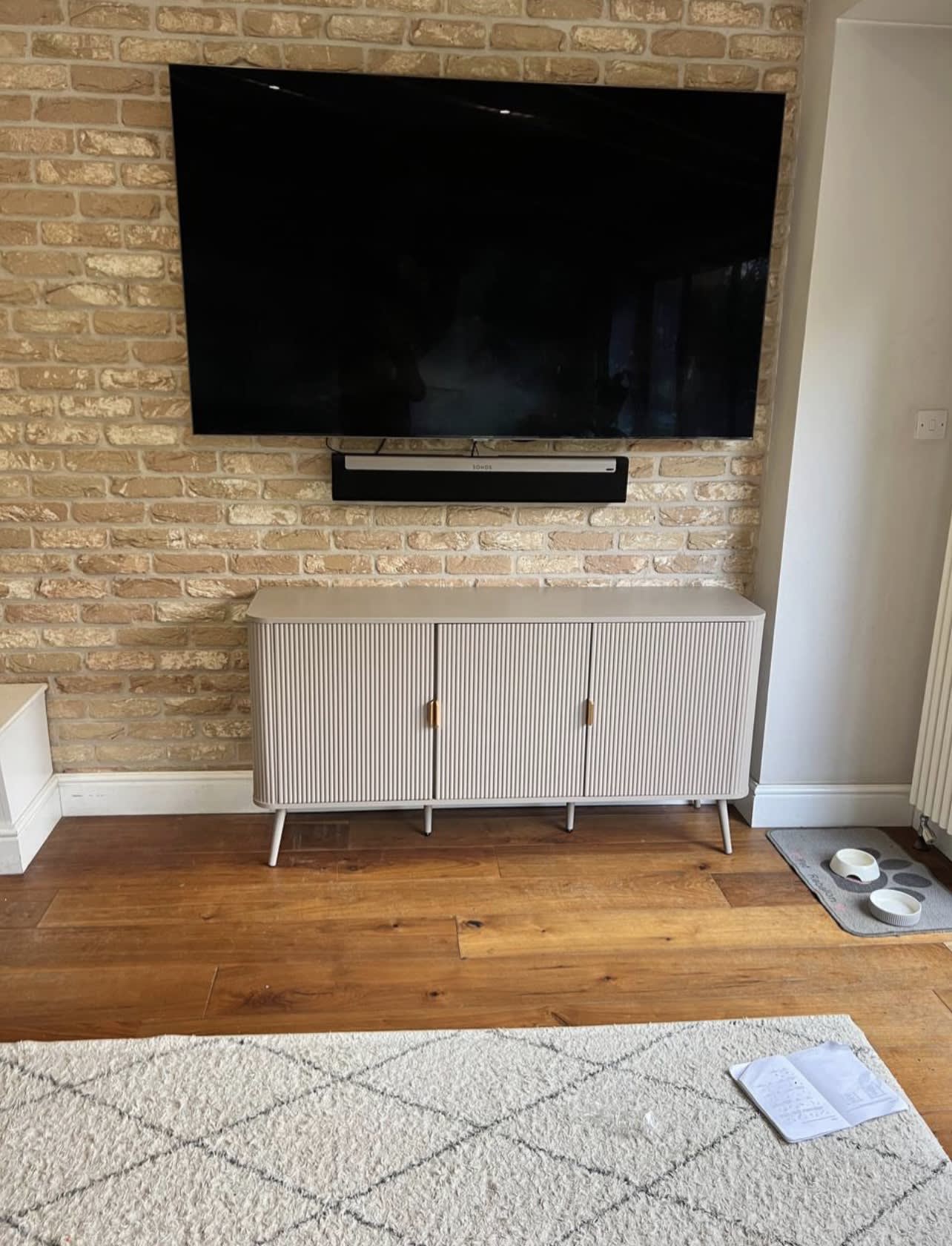 TV & Soundbar on Brick Wall
